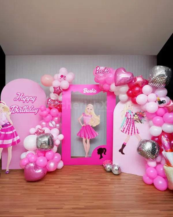 A Barbie dream party with all the pink and sparkle you can imagine. This setup features multiple backdrops, a life-sized photo frame, character cutouts, and fabulous balloon arrangements with disco ball accents.