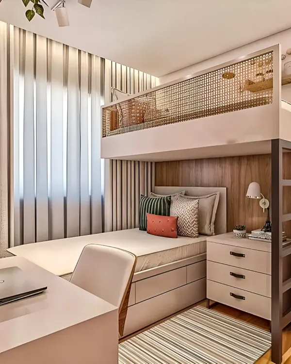 A perfect example of my space-saving solutions. This custom loft bed integrates a comfortable sleeping area above a dedicated study space and storage, making the most of a small room's vertical space.