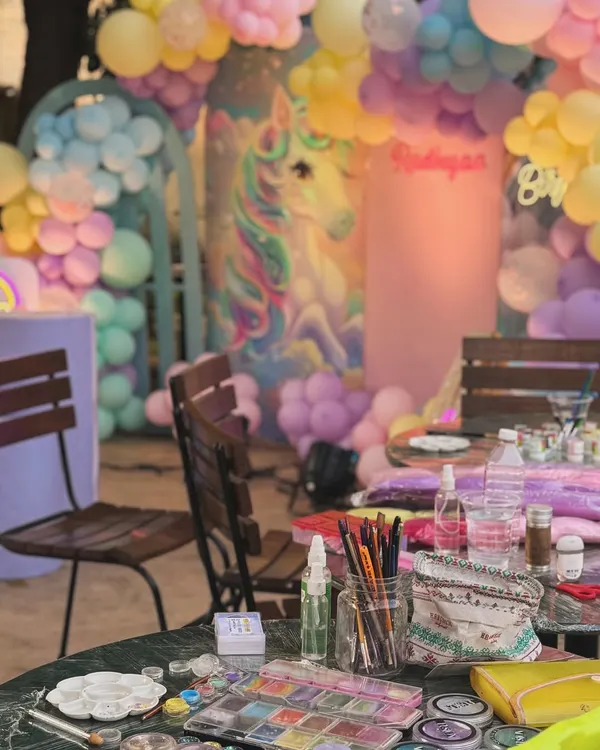 Our setup at a unicorn-themed birthday party. We come prepared with a full range of professional, skin-safe paints and brushes for any theme.