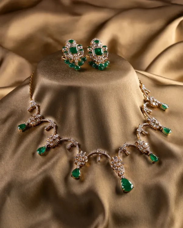 The complete Aurora Verde bridal set. We paired natural Zambian emeralds with a mix of round and baguette diamonds in 18K gold to create a look that feels both classic and modern. The necklace and matching earrings are designed for presence and balance.