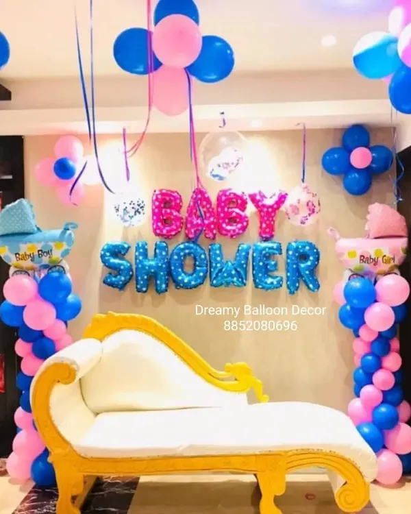 For this baby shower, I provided a complete setup including a special queen chair for the mom-to-be. The backdrop features "Baby Shower" foil balloons, balloon pillars, and themed baby carriage foil balloons in pink and blue.