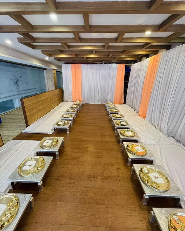 An overview of my Royal Thali seating arrangement. The low chowki tables and individual thalis create an intimate and traditional dining setting, perfect for special family gatherings or pre-wedding functions.