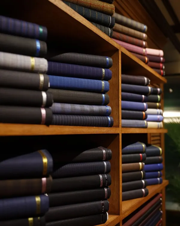 The foundation of any great garment is the fabric. My atelier is stocked with an extensive collection of the world's finest textiles, waiting to be transformed into your bespoke outfit.