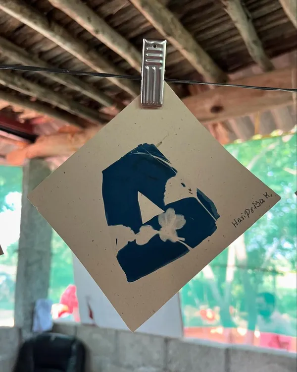 A cyanotype print created by a child during our outreach day with the Garike initiative in Kolar district. The children used found objects and their own hands to make art.