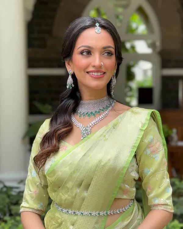 This is my signature ethereal look, perfect for the modern bride. I focused on creating luminous, dewy skin and soft, defined eyes to complement the beautiful pastel green saree, resulting in a timeless and graceful South Indian bridal style.