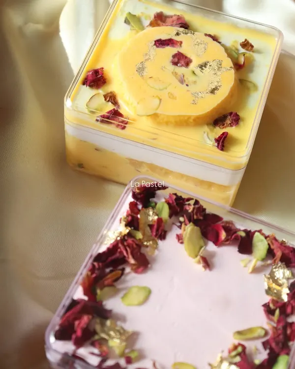 My two most popular fusion dessert tubs: the Rasmalai Tres Leches and the Rose Tres Leches. Both are topped with pistachios, rose petals, and edible gold.