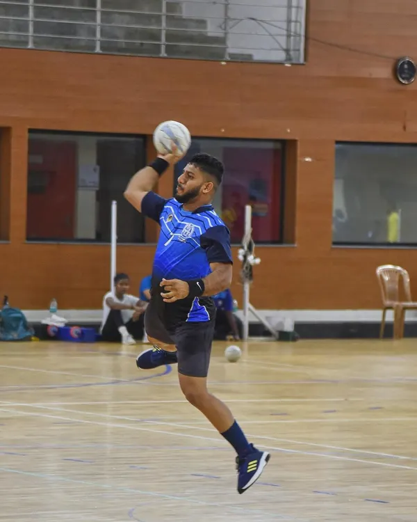 Capturing the peak moment of athletic power. This handball player is frozen mid-air, muscles tensed, right before releasing a powerful shot during a training session for the National Games. This is the kind of explosive action photography I love to shoot.