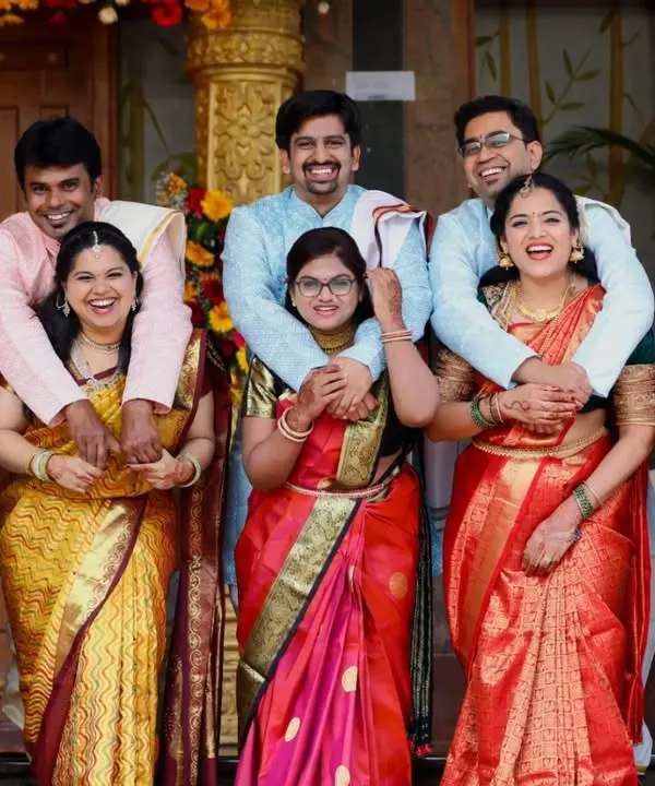 Capturing the entire extended family in one happy, candid shot is a specialty of ours. This photo from a family gathering is full of laughter and connection.