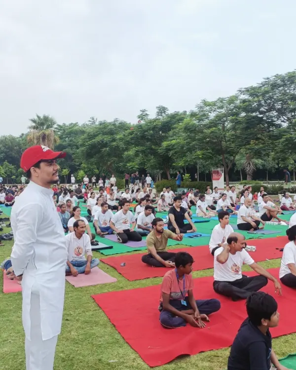 Addressing a large gathering during an outdoor yoga event. It is my passion to share the benefits of yoga with as many people as possible, creating a wave of positive energy.