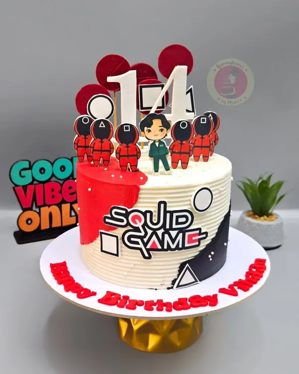 A "Squid Game" themed cake for a 14th birthday, featuring the iconic characters and symbols from the show.
