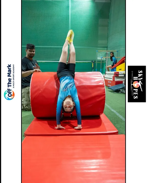 Control is a flex. A young gymnast demonstrates a perfect handstand using our training equipment, showing incredible strength and balance.