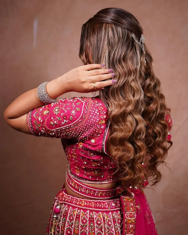 These are the kind of soft, defined waves that every client wants. I'll teach you the curling and setting techniques to create this beautiful open hairstyle, perfect for a reception or sangeet.