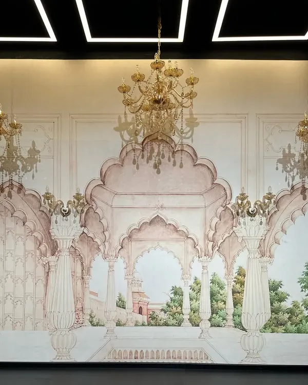 A close-up of our hand-painted Haveli-style set. The detailed murals, arches, and golden chandeliers are designed to give your shoots a touch of royalty, perfect for wedding choreography, classical dance, or ethnic fashion campaigns.