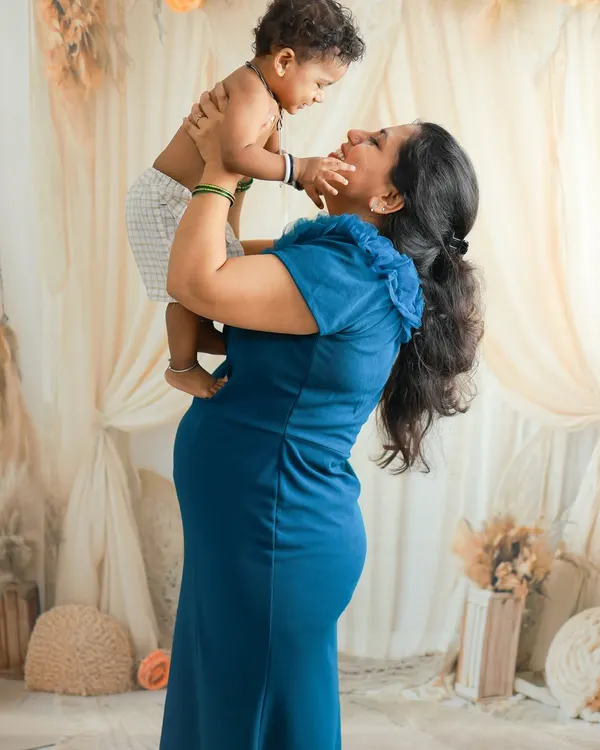 This is the heart of it all. Celebrating the love that fills a home as it prepares to welcome a new life. This beautiful mother-to-be shares a joyful moment with her first child, a perfect memory captured during a family maternity session with a soft, boho-inspired setup.