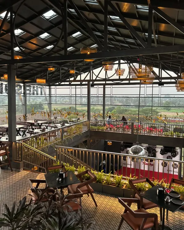 A wide angle of our project at The Soda Factory in Mandya. The plantscaping was designed to complement the open, airy architecture, with greenery lining the upper and lower levels to create a cohesive, natural feel throughout the large space.