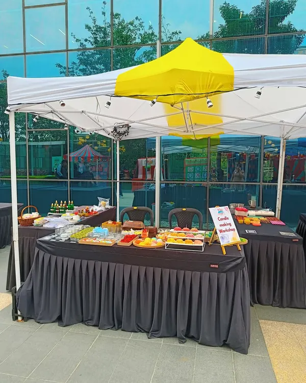 Our live candle making booth setup at an outdoor corporate event at Eco Space, Bangalore. We bring all the materials for guests to create their own candles on the spot.