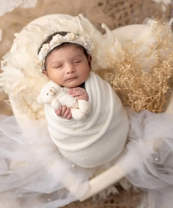 A perfect little soul, wrapped in love and nestled in a heart. This is the essence of my newborn photography, creating pure and angelic portraits.