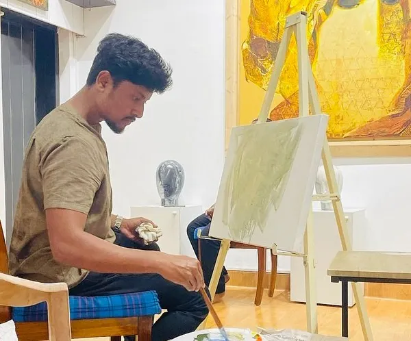 Beginning a live oil portrait at Rendition Art Gallery in Juhu. The initial stage involves laying down a tonal ground to establish the light and shadow before building up the details.