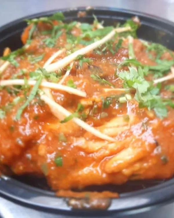 Our special Chicken Adraki, a flavourful curry with a prominent taste of fresh ginger. It's garnished with ginger juliennes and coriander.