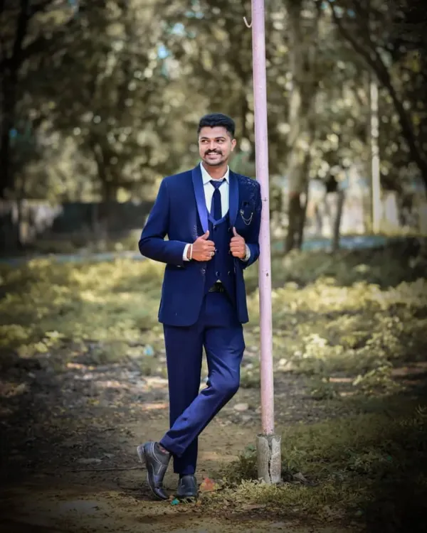 A client looking sharp in a navy blue three-piece suit from my men's rental collection. A timeless choice for any formal occasion.