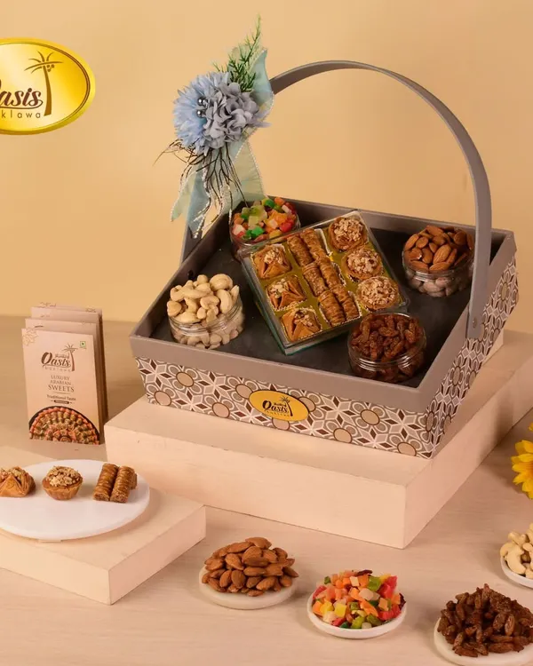 This elegant grey hamper basket is perfect for a sophisticated gift. Filled with my signature baklava, assorted nuts, and candied fruits, it's a versatile choice for anniversaries, birthdays, or corporate thank-yous.