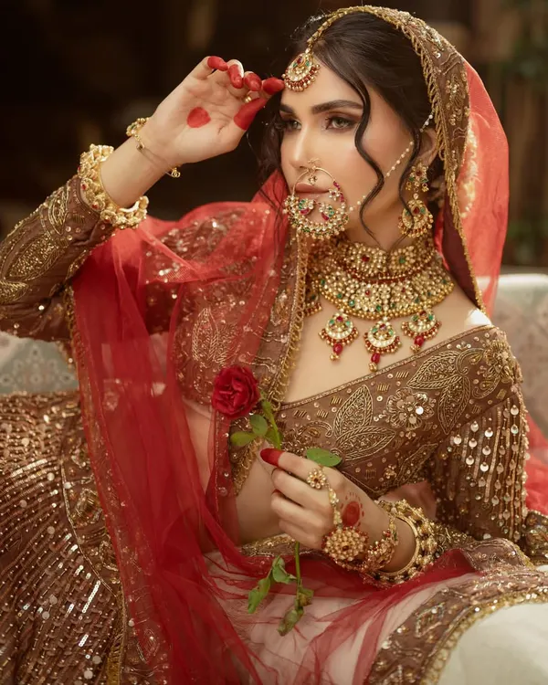 This is the look that bridal dreams are made of. A rich, traditionally embroidered lehenga paired with a full kundan jewellery set gives you that perfect royal bride look for your special day.