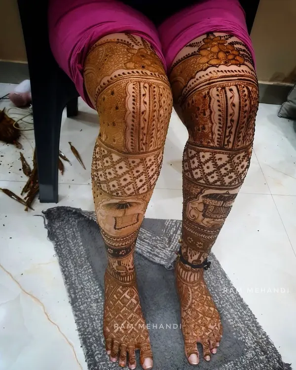 A full-coverage bridal leg mehndi design. I continue the story from the arms onto the legs, using intricate patterns and portraits to create a complete bridal look.