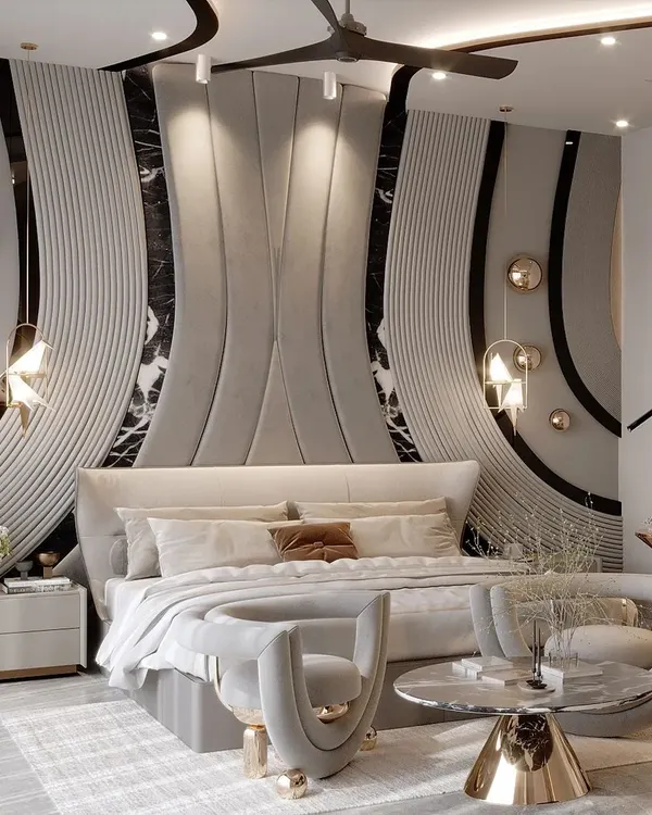 Inspired by the fluid curves of the feminine form, this bedroom uses a sophisticated grey palette with delicate gold accents. The wall paneling and furniture feature sinuous patterns that evoke elegance and sensuality.
