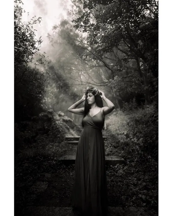 This is where my art finds its voice. A fine art portrait captured in a misty Bangalore forest, using natural light to create a timeless, ethereal mood. This black and white image focuses on emotion and atmosphere over everything else.