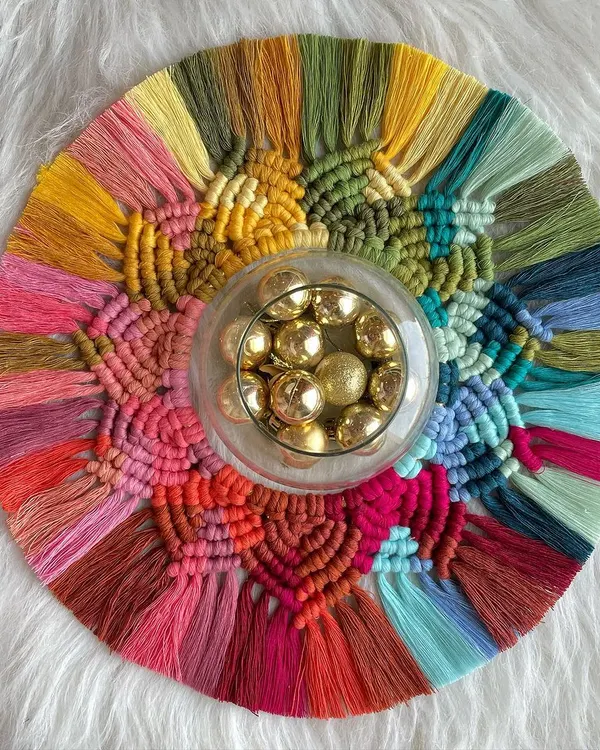 My macrame rangoli is a sustainable way to decorate for Diwali. This piece is full of vibrant colors and can be used as a table centerpiece with a diya or hung on the wall after the festival.