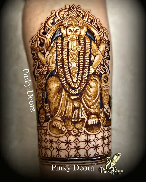 A powerful portrait of Lalbaug Cha Raja, created with immense devotion. This full-arm design captures the majesty and divinity of Bappa, making it a perfect tribute for Ganesh Chaturthi.