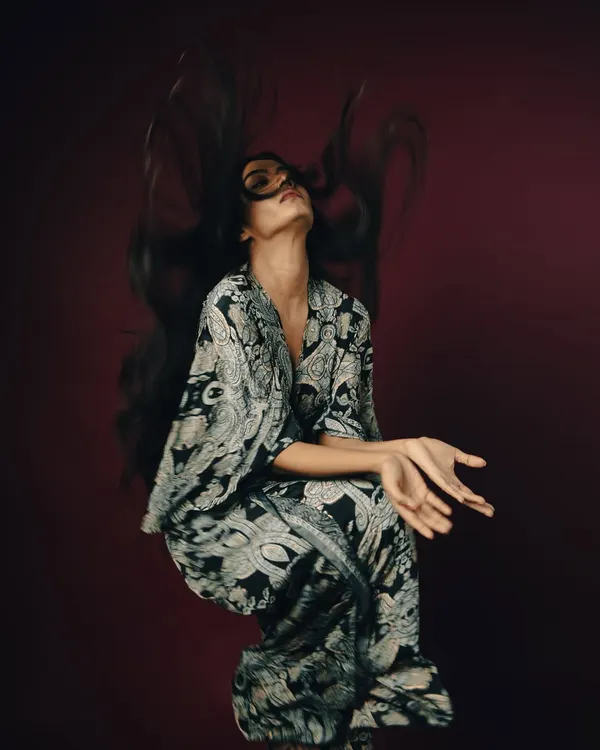 This shot is the definition of capturing movement. I used a fast shutter speed and studio strobes to freeze the model's hair mid-toss, creating a spectacular, gravity-defying shape. It’s a powerful way to showcase volume, texture, and the artistry of hair styling.
