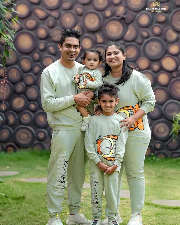 A perfect family day out. We love it when families coordinate their outfits, like these adorable matching sweatshirts. This outdoor portrait captures the happy, united spirit of this family of four.