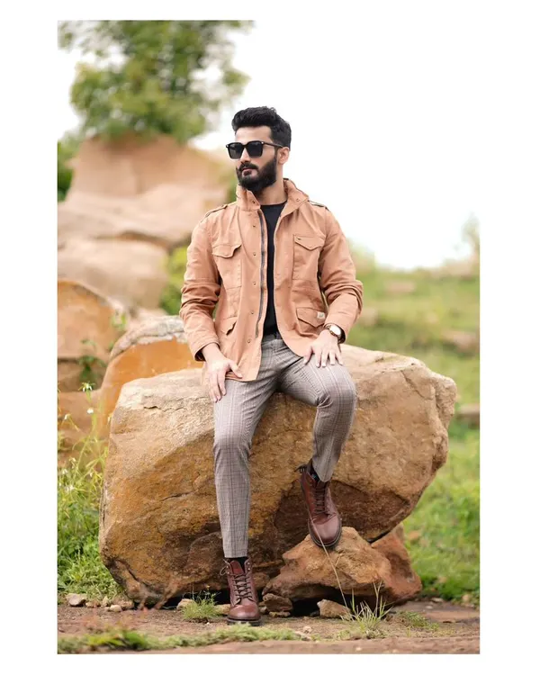 For men's fashion, I focus on capturing a sense of confident, effortless style. This outdoor portfolio shoot combines a rugged natural landscape with a dapper, layered look, creating a compelling commercial image for fashion brands.