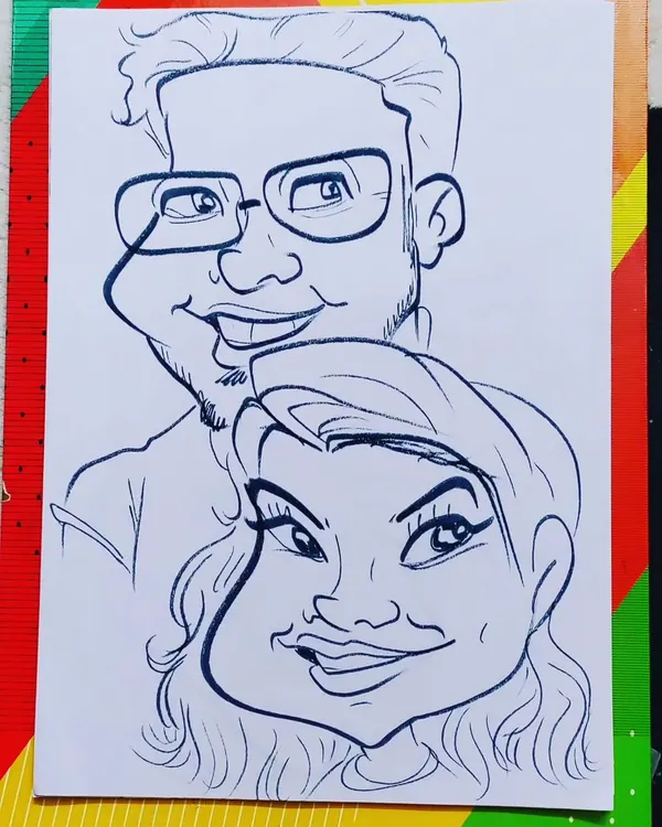 A fun and lively caricature of a smiling couple. I focused on their happy expressions to create a piece full of positive energy.