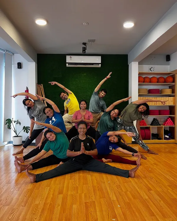 Flex, stretch, and laugh. A beautiful group pose that captures the harmony and connection of our Friday asana practice.
