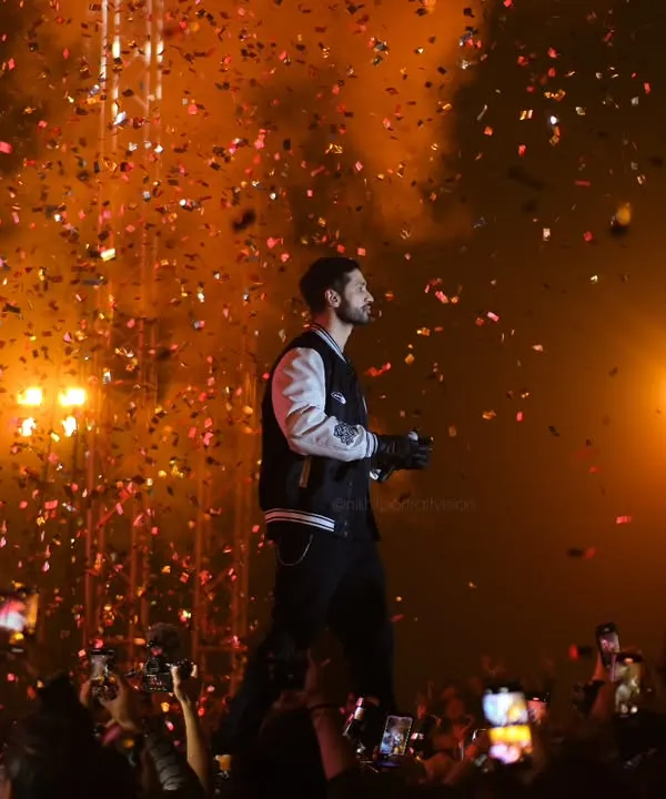 This is the moment I live for. Capturing singer Arjun Kanungo as confetti rains down, freezing the peak energy of his performance in a single, explosive frame.