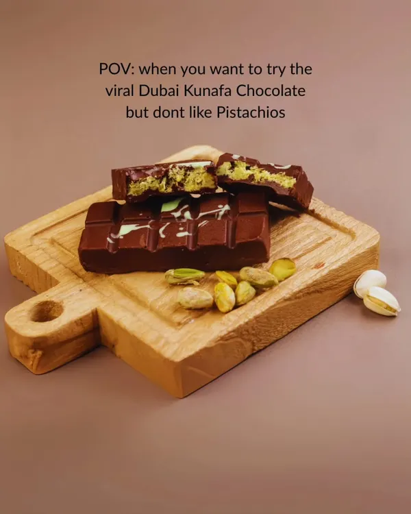 For everyone who wants to try the viral Dubai Kunafa chocolate but isn't a fan of pistachios, I've got you covered. This image shows off the classic bar, but I offer plenty of other delicious fillings.