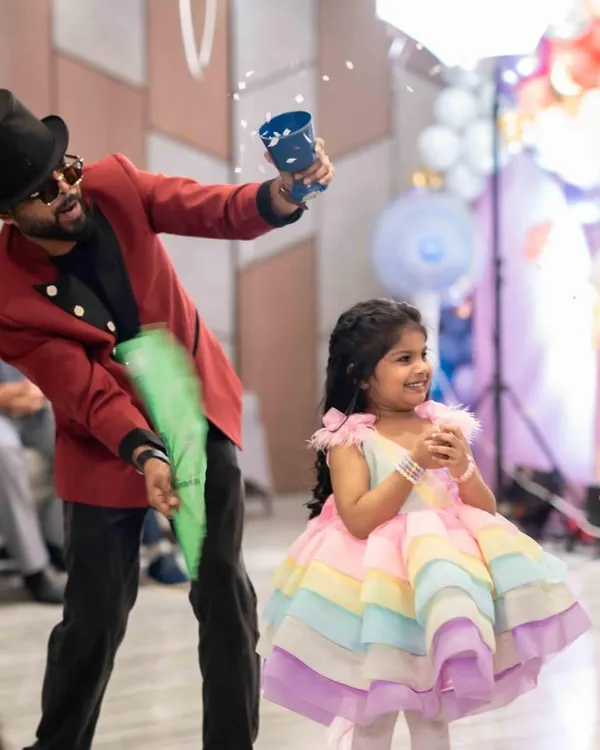 The pure joy on a child's face is the best magic of all. Here, I'm making the birthday princess feel extra special with a surprise confetti shower during her candyland themed party.