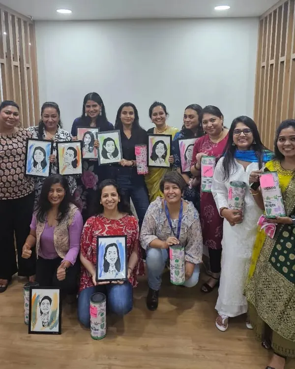 The wonderful team at Pidilite Industries holding their custom caricatures during a Women's Day celebration. It was an honor to create these unique gifts for them.