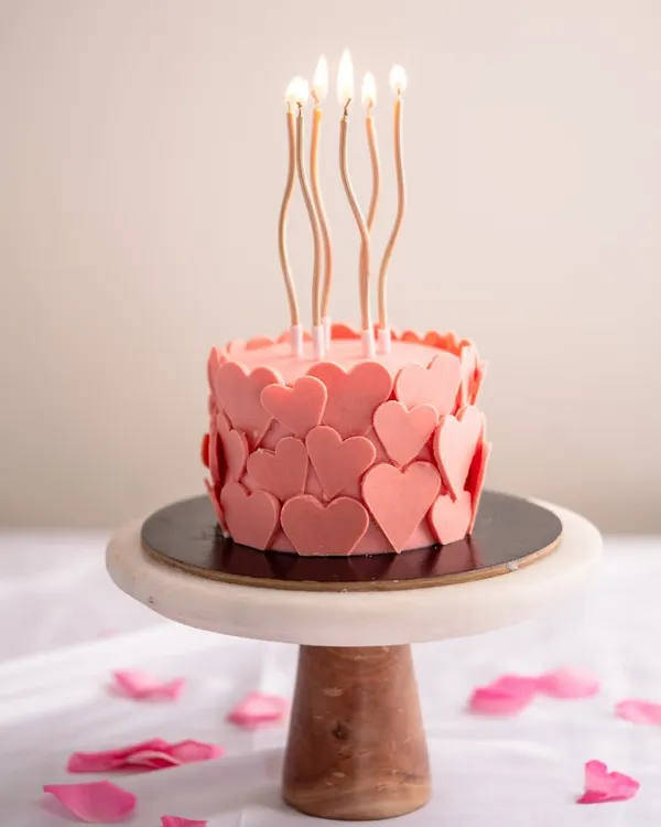 My Valentine's Heart Cake, specially crafted for the season of love. This pink cake is adorned with delicate hearts, making it a beautiful and delicious way to celebrate.