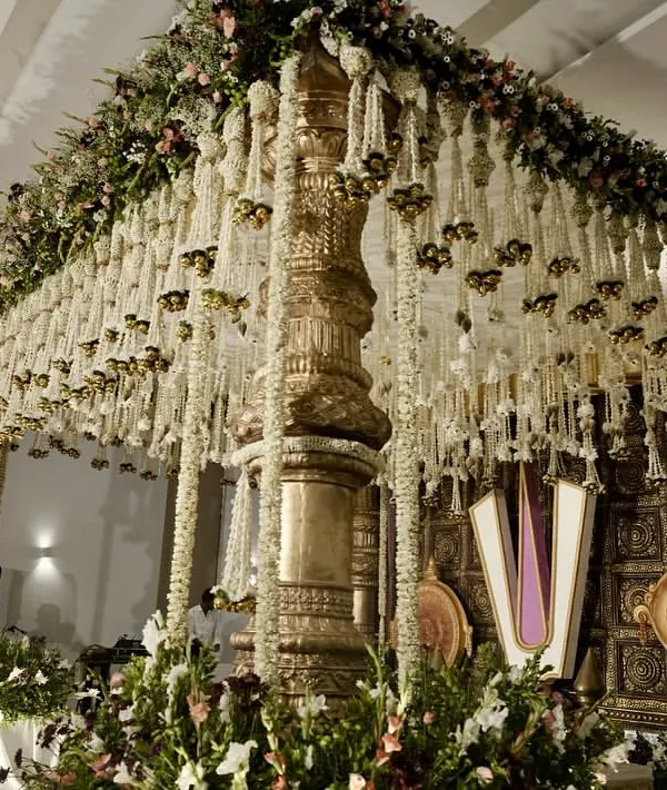 We believe a mandap is more than a stage; it's a sanctuary. For this wedding, we designed a temple-style mandap with grand golden pillars and a canopy of cascading jasmine, creating a sacred space that felt both royal and deeply personal.