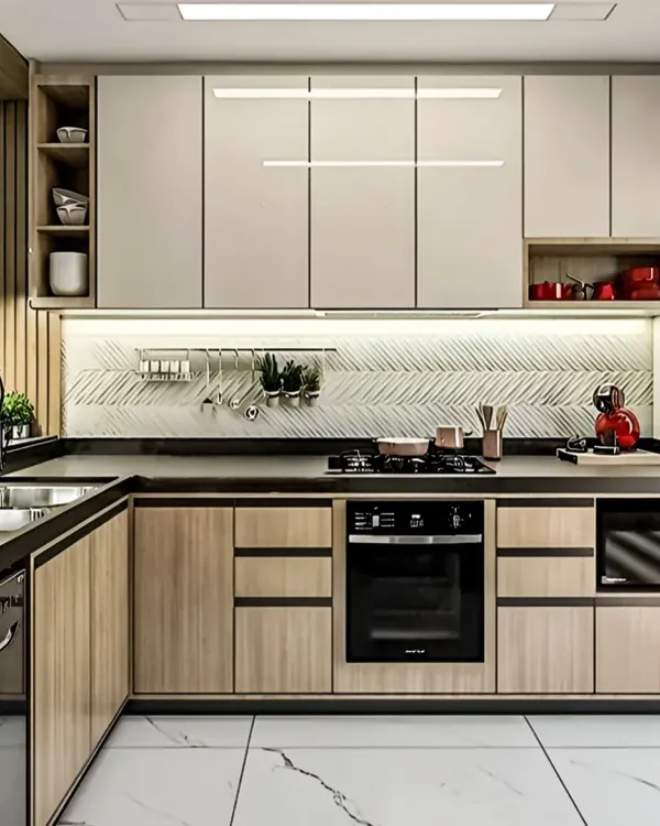 A modern L-shaped kitchen featuring a two-tone scheme with wood-finish base cabinets and off-white wall cabinets. The design is enhanced by a textured backsplash and integrated under-cabinet lighting for a functional workspace.