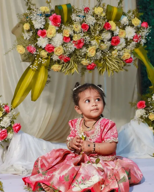 This little one is celebrating her naming ceremony in a custom pattu pavadai I designed. I used a beautiful pink Banarasi silk and focused on making it comfortable for her, with a soft cotton lining inside. It’s so important to me that children feel happy and can move freely during their special occasions.
