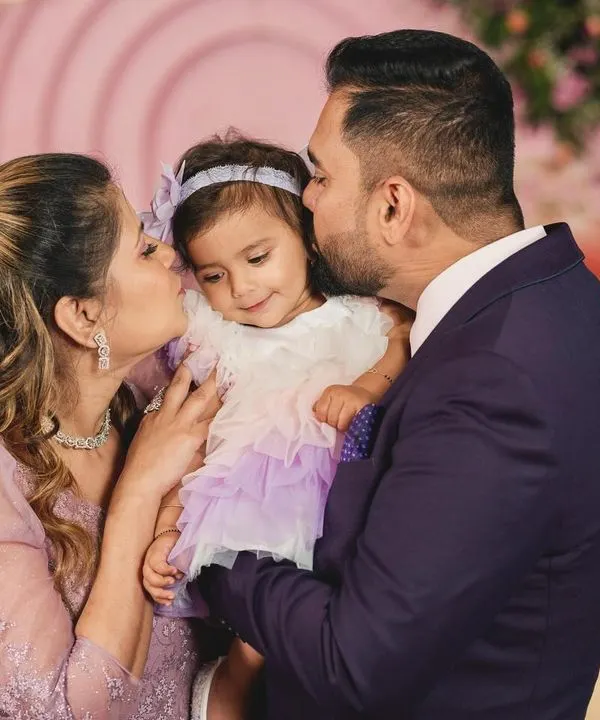 A precious moment with fairy Nia and her parents. The love and happiness in this photo are what make my work so rewarding.