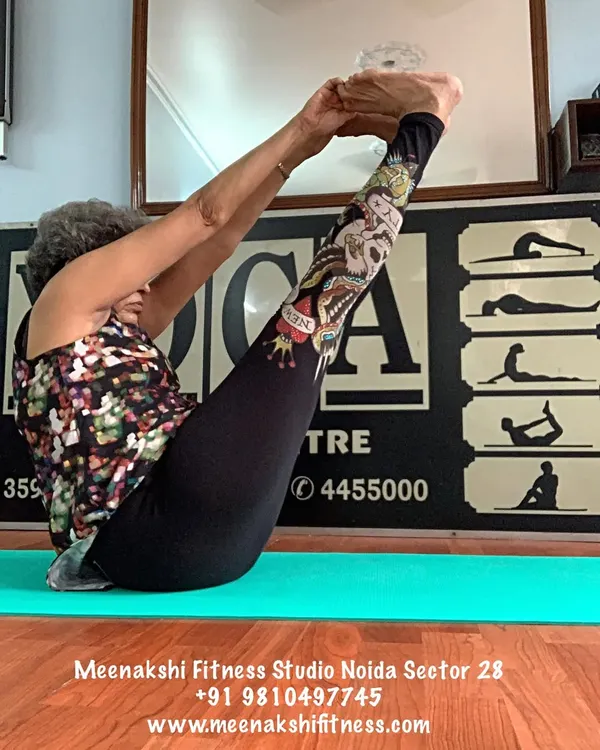 Paripurna Navasana, the full boat pose. This asana is a fantastic workout for the core and hip flexors, which I teach with modifications for all levels.