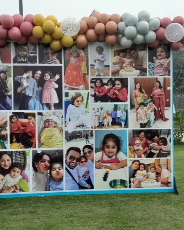 Cherish your memories with a custom photo collage backdrop. This large display, framed by a colorful balloon garland, is a wonderful centerpiece for birthdays, anniversaries, and family gatherings.