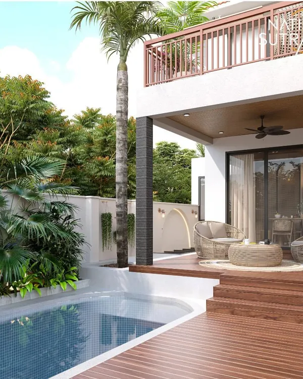 This poolside deck is designed as a personal sanctuary, blending natural materials with lush greenery. We focused on creating a seamless transition from the home to the outdoors, using a warm wooden deck, comfortable rattan seating, and a variety of tropical plants to craft a tranquil escape.