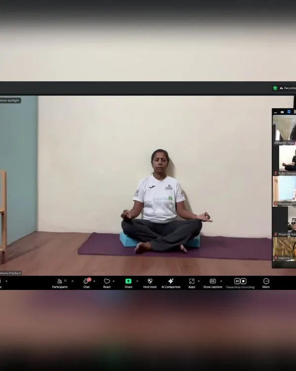 This is a snapshot from one of our online meditation sessions, where I am guiding students through a seated meditation practice. Even through a screen, we create a focused and serene environment for everyone to connect with their inner selves.