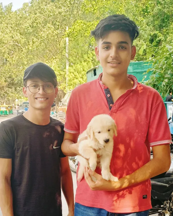 A happy customer's smile is my greatest earning. This young man is taking home a beautiful Golden Retriever puppy, and I know they will have many happy years together.